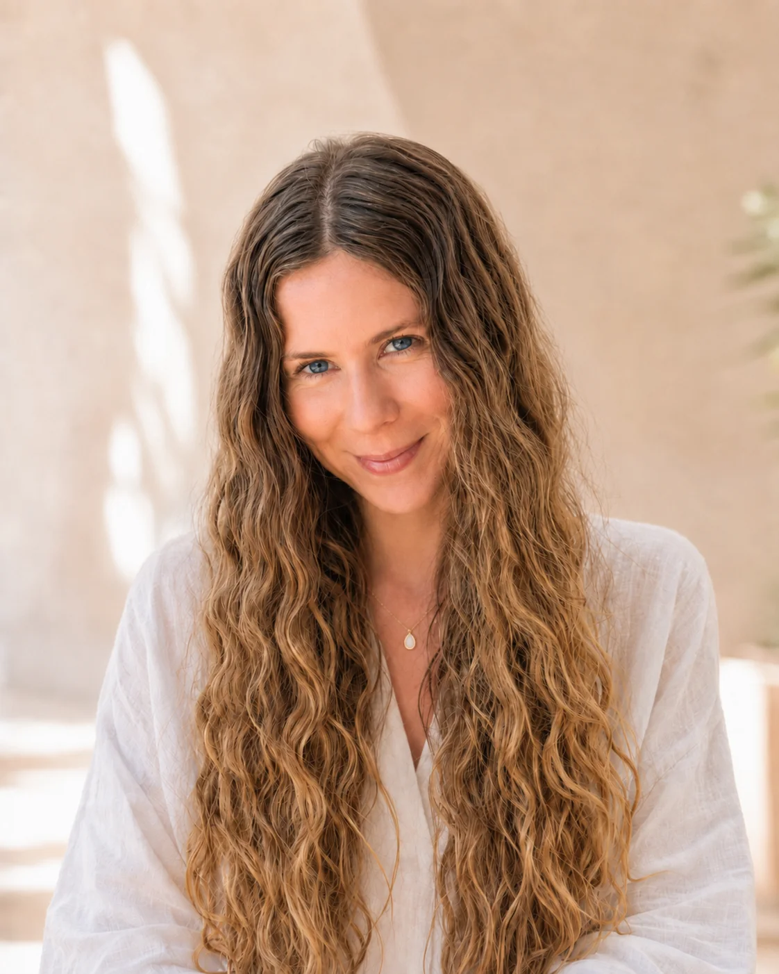 Founder of Golden Light Media in a softly lit wellness setting