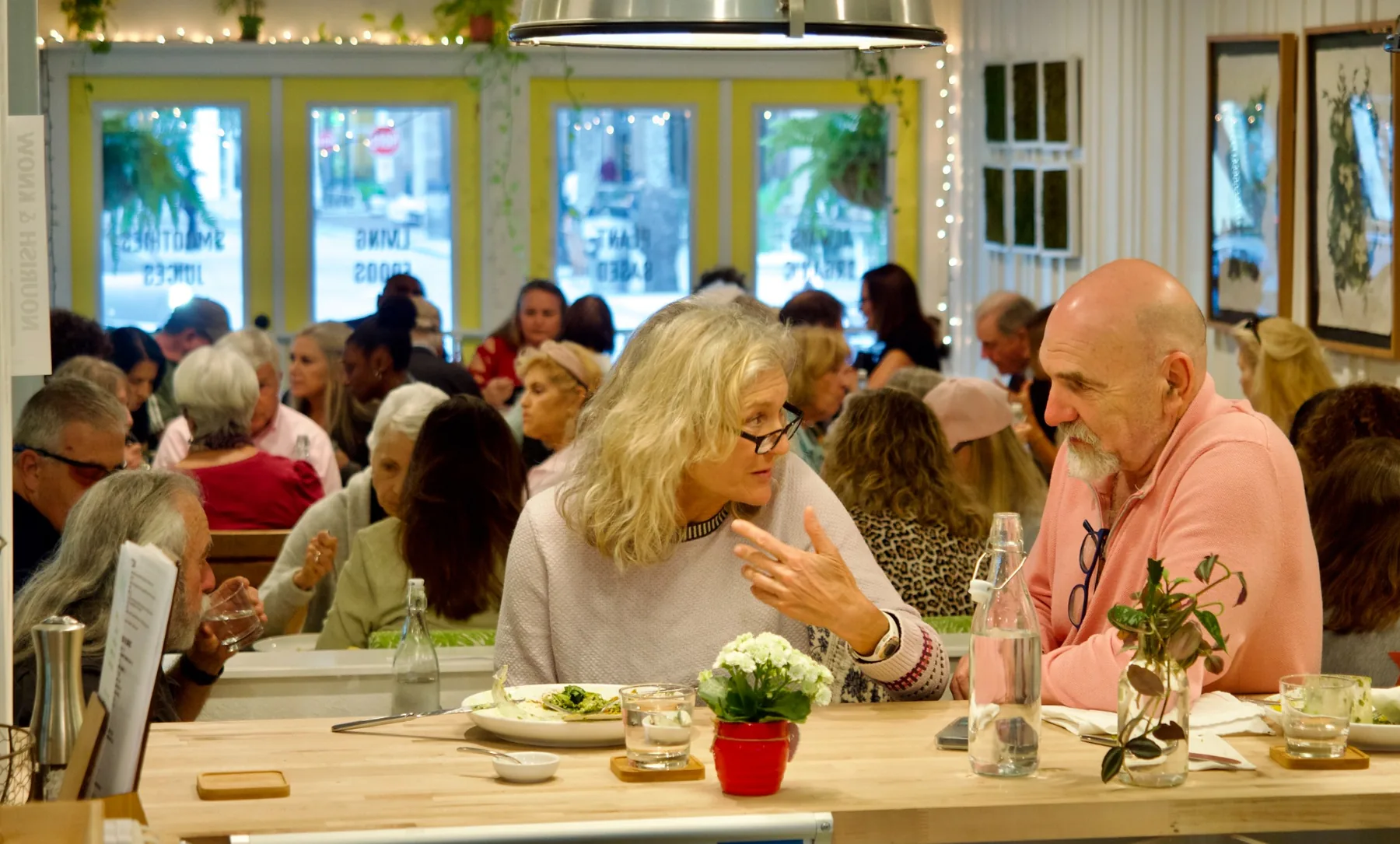 Guests gathering and connecting inside Ionie Raw Living Foods