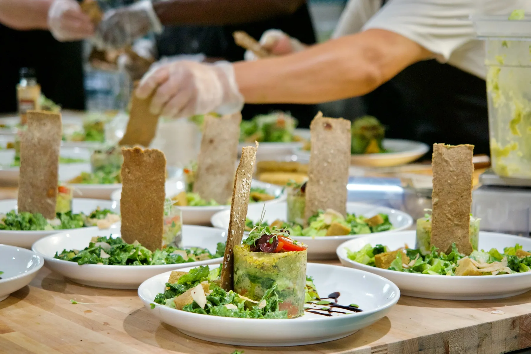 Fresh raw living food being carefully prepared in the café kitchen