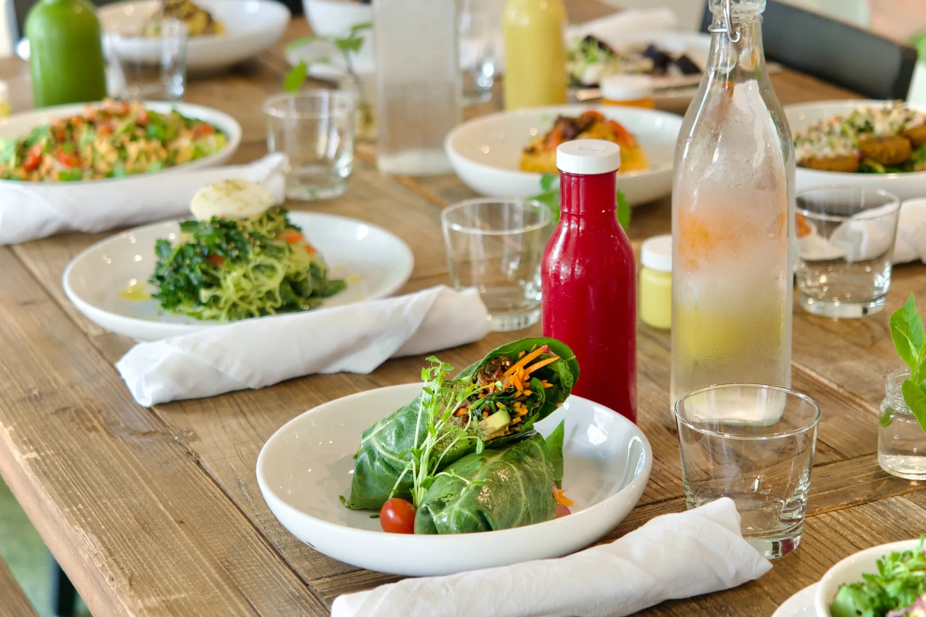 A vibrant table of organic plant-based dishes at Ionie Raw Living Foods