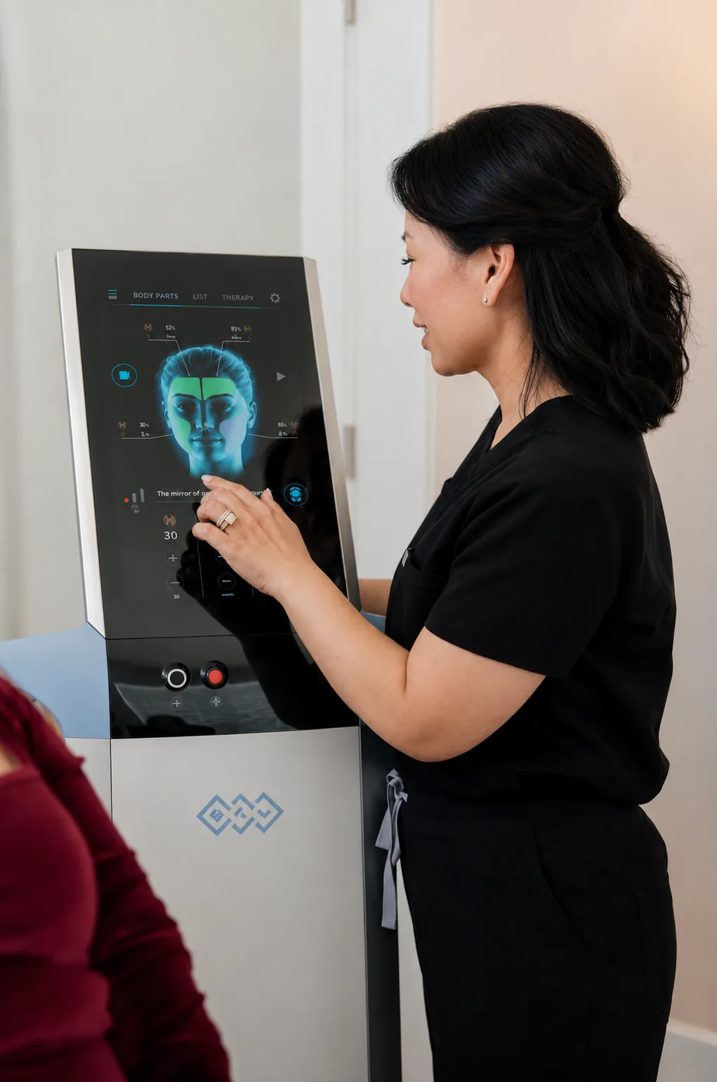 A Luminance practitioner operating advanced aesthetic technology